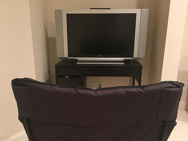 tidy video game corner in the basement