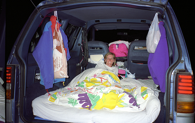 futon mattress as a bed in the back of a minivan